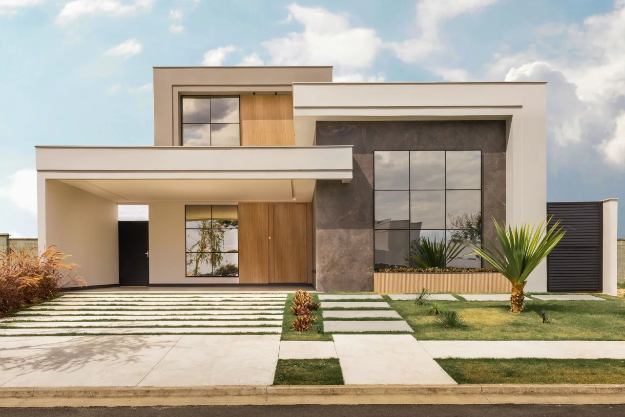 Modern residential exterior with prominent black-framed windows